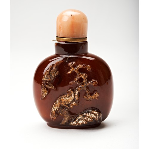 295 - TWO CARVED AGATE SNUFF BOTTLES QING DYNASTY, 19TH CENTURYone carved with an eagle within a rocky out... 