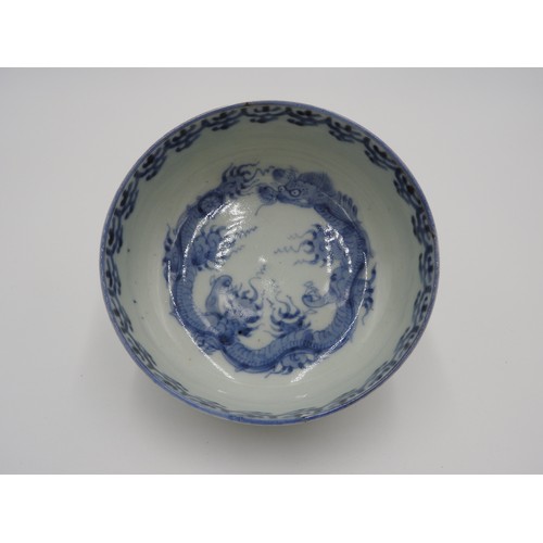 281 - JAPANESE BLUE AND WHITE 'DRAGON' BOWLEDO PERIODthe interior painted with a scaly dragon chasing a fl... 