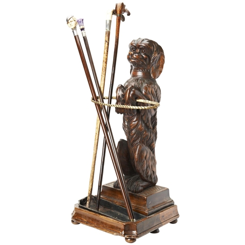 109 - A GOOD 19TH CENTURY BLACK FOREST BRASS-MOUNTED LINDEN WOOD STICK STAND in the form of a begging dog ... 