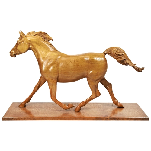 117 - A LARGE CONTEMPORARY CARVED WOODEN SCULPTURE OF A GALLOPING HORSEon a wooden platform base132 cm x 8... 