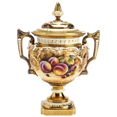 197 - A ROYAL WORCESTER TWIN HANDLED 'FRUIT STUDY' POT POURRIby P. Fuller, with reticulated lid and side h... 