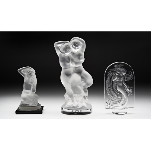 223 - A MODERN LALIQUE 'WATER NYMPH' PLAQUE, a 'Nymph and Satyr' statuette and a small nude figurine on a ... 