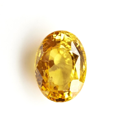 238 - A LOOSE YELLOW SAPPHIREthe oval cut yellow sapphire, stated to weigh 14.68 carats, not tested for tr... 