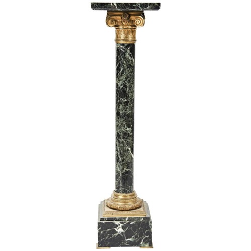 104 - A 19TH CENTURY SERPENTINE COLUMNthe square top over an architectural bronze embellished capital, the... 