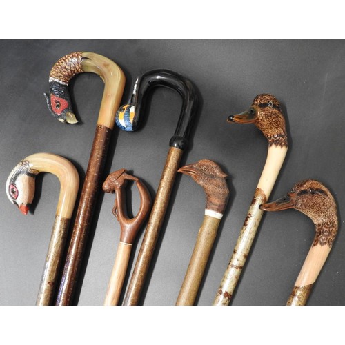 68 - SEVEN 20TH CENTURY SCOTTISH WOOD AND HORN WALKING STICKS variously carved as game birds