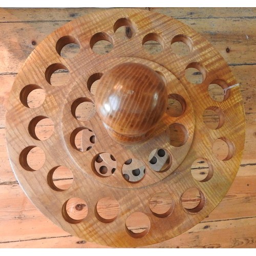 70 - A 20TH CENTURY WOODEN CIRCULAR WALKING STICK STAND with two concentric sets of holes87 cm high... 