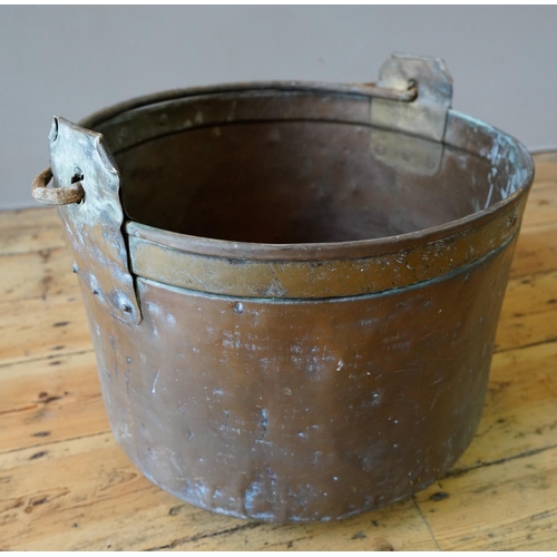 84 - 19th CENTURY RIVETED COPPER BUCKET WITH IRON RING HANDLE (52cm diameter, 30cm deep,