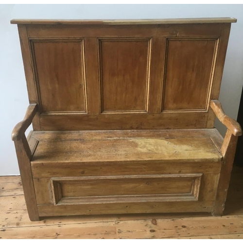 43 - 19th CENTURY WAXED PINE PANELLED SETTLE, with lift top seat with storage below136 x 150 x 53cm