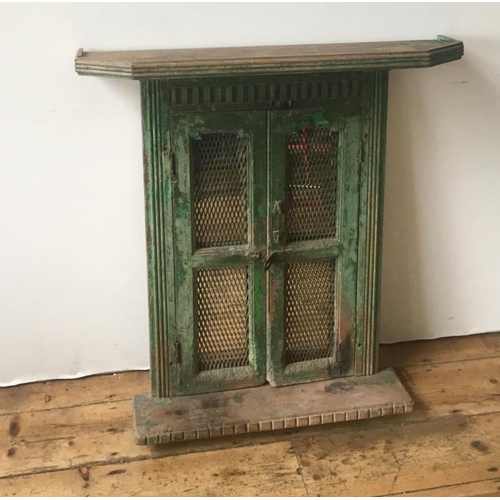 45 - MIRROR PANEL IN DISTRESSED GREEN PAINTED WOODEN FRAME, protected with a pair of fret work panelled s... 