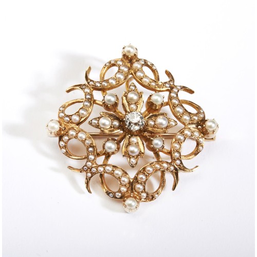 588 - A late Victorian 15ct gold pearl and diamond brooch / pendant, the openwork scrolling panel centrall... 