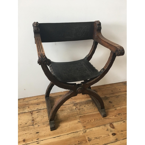 48 - 19th CENTURY SAVONAROLA FOLDING CHAIR, with ornate embossed leather seat and back panels89cm high x ... 