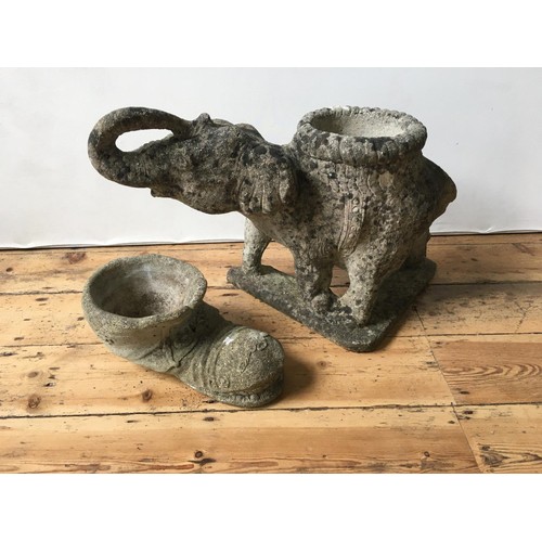 86 - WEATHERED RECONSTITUTED STONE GARDEN FIGURE OF ELEPHANT AND SHOE PLANTER, 48cm high