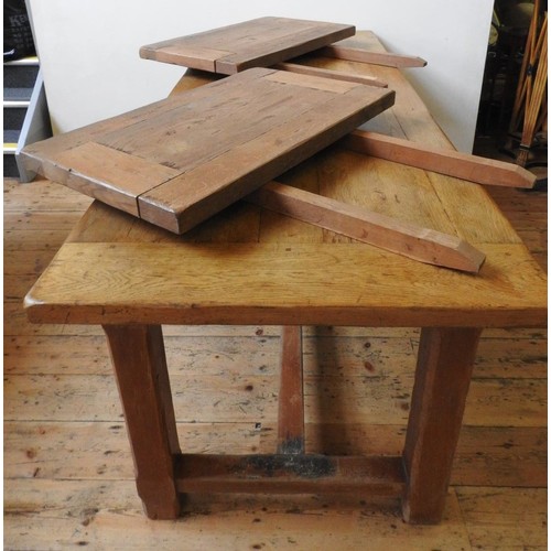 82 - A FRENCH 19th CENTURY OAK FARMHOUSE TABLE, with two side drawers and stretcher bar supporting square... 