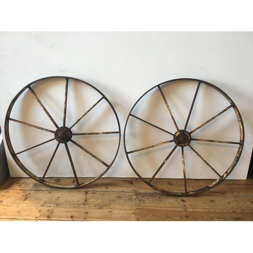 605 - A PAIR OF 19th CENTURY IRON FARM WHEELS104cm dia