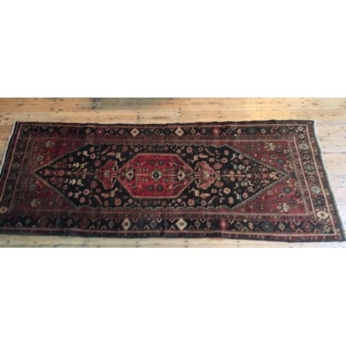 97 - A IRANIAN HAND KNOTTED KORDI RUG, 292 x 117