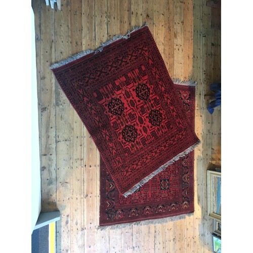 93 - TWO EASTERN BORDER PATTERN RUGS, one badly worn in places205 x 153cm