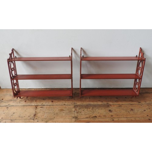 3 - PAIR OF RED PAINTED HANGING WALL SHELVES20TH CENTURYwith fret pierced sides67cm high, 69.5cm wide... 