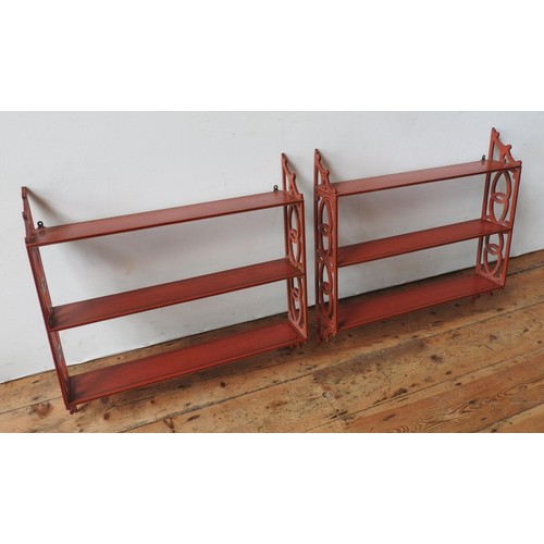 3 - PAIR OF RED PAINTED HANGING WALL SHELVES20TH CENTURYwith fret pierced sides67cm high, 69.5cm wide... 