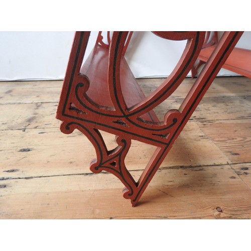 3 - PAIR OF RED PAINTED HANGING WALL SHELVES20TH CENTURYwith fret pierced sides67cm high, 69.5cm wide... 