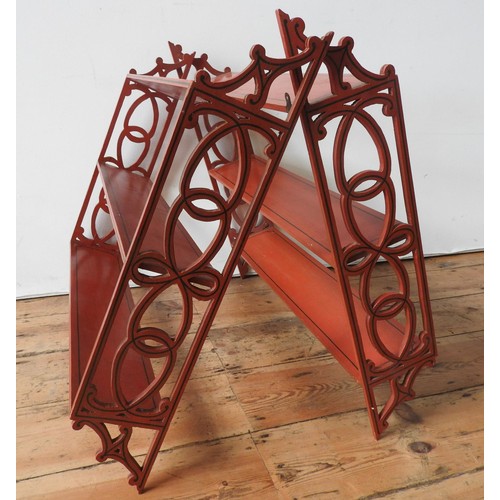 3 - PAIR OF RED PAINTED HANGING WALL SHELVES20TH CENTURYwith fret pierced sides67cm high, 69.5cm wide... 