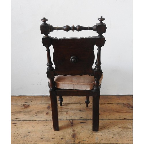 15 - A VICTORIAN MAHOGANY CHILD'S CHAIR, on turned wooden legs, with turned pillar back supports and leaf... 