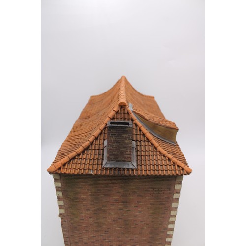 399 - A MODEL OF FLEMISH FARM HOUSE, robust ply construction with moulded detail, 36cm high x 45cm wide