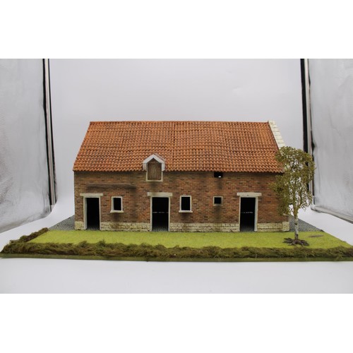 400 - A LARGE MODEL BARN ON COBBLED AND LAWN BASE, durable moulded construction with 3-D detail, 25cm high... 