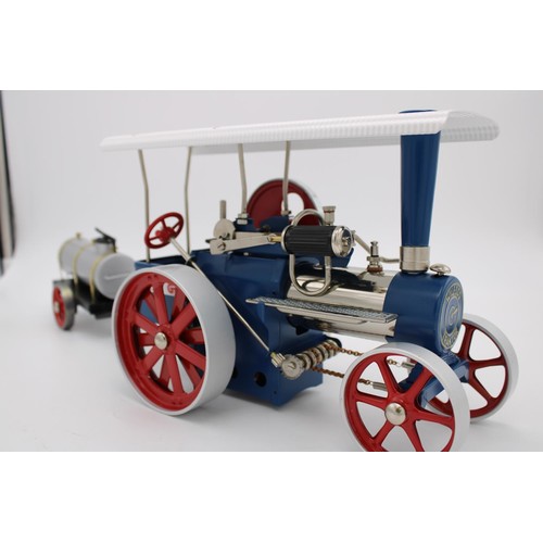 434 - WILESCO LIVE STEAM ROLLER/TRACTION ENGINE, 30cm long, boxed as new with water cart trailer, 23cm lon... 