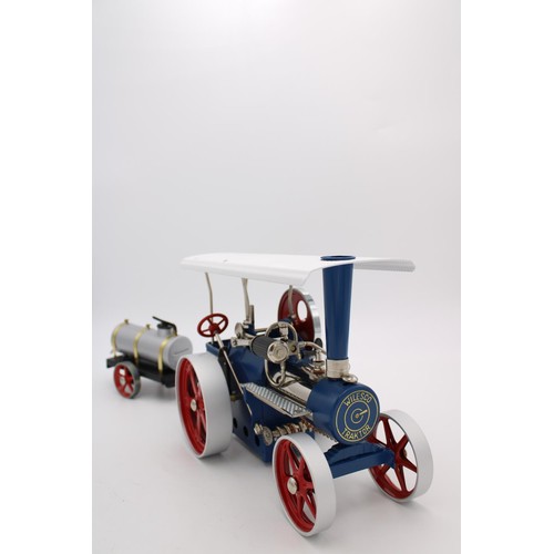 434 - WILESCO LIVE STEAM ROLLER/TRACTION ENGINE, 30cm long, boxed as new with water cart trailer, 23cm lon... 