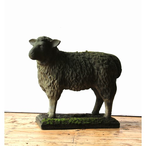 99 - A CAST WEATHERED RECONSTITUTED STONE GARDEN FIGURE OF SHEEP ON RECTANGULAR PLINTH, 66cm high x 68cm ... 