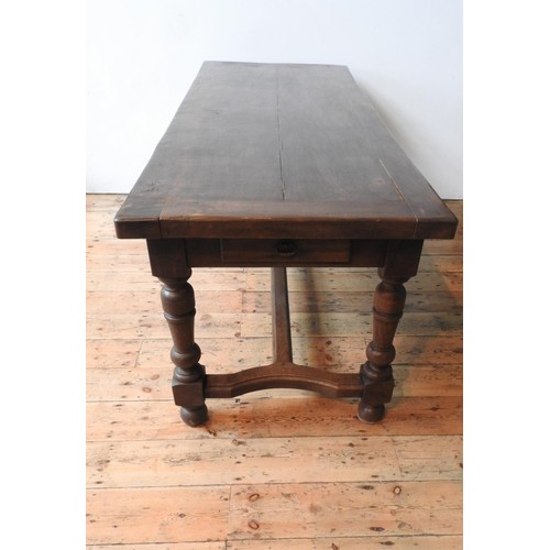 19 - A 19TH CENTURY FRENCH OAK FARMHOUSE TABLE ON TURNED LEGS, on shaped stretcher bar support with singl... 