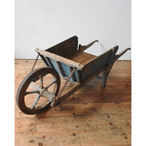 21 - A RUSTIC FRENCH 19th CENTURY BLUE PAINTED WHEEL BARROW, with removable side panels, 59 x 67 x 190cms