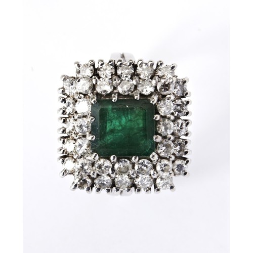 502 - AN 18CT WHITE GOLD EMERALD AND DIAMOND SET RING