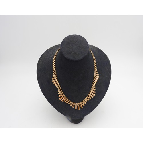 503 - A 9CT GOLD WAVE FORM NECKLACE