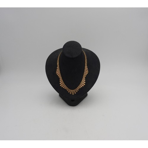 503 - A 9CT GOLD WAVE FORM NECKLACE