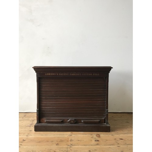 36 - AN AMBERG LATE VICTORIAN OAK PATENT CABINET LETTER FILE, The rectangular moulded top above a frieze ... 