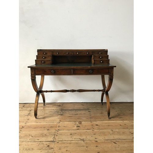 43 - A VERY GOOD QUALITY REPRODUCTION YEW WOOD LEATHER TOP WRITING DESK, with 8 small stationary drawers ... 