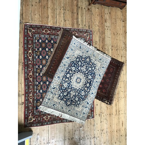 94 - A BORDER PATTERN EASTERN RUG WITH REPEATING FLORAL MOTIF AND TWO SMALLER EASTERN RUGS, the largest r... 