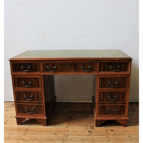 54 - A YEW WOOD TWIN PEDESTAL LEATHER TOP WRITING DESK, three drawers over two banks of two, 74 x 125 x 5... 