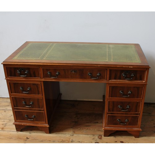 54 - A YEW WOOD TWIN PEDESTAL LEATHER TOP WRITING DESK, three drawers over two banks of two, 74 x 125 x 5... 