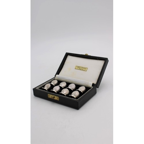 468 - A SET OF 8 BOXED SILVER PLATED MENU HOLDERS IN THE FORM OF OYSTER SHELLS