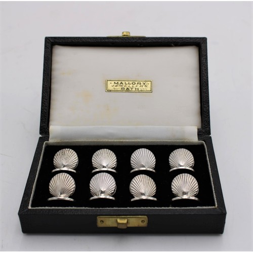 468 - A SET OF 8 BOXED SILVER PLATED MENU HOLDERS IN THE FORM OF OYSTER SHELLS