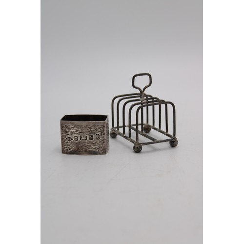 470 - A HALLMARK SILVER SMALL TOAST RACK AND NAPKIN RING, the ring London 1977, 2.5 oz in total