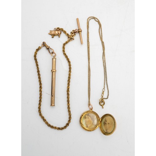 518 - A 9CT GOLD PROPELLING TOOTH PICK AND CHAIN WITH GOLD PIG CHARM AND A 9CT GOLD LOCKET WITH CHAIN, 18g... 