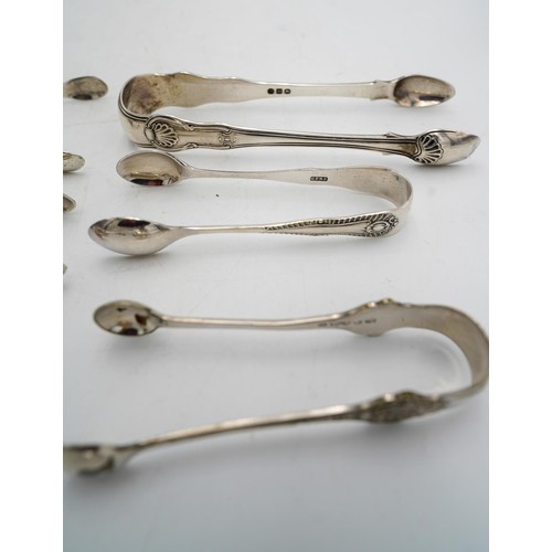 474 - FOUR PAIRS OF ENGLISH SILVER SUGAR TONGSVARIOUS MAKERS AND DATES5.1 troy ozs.159 grams together with... 