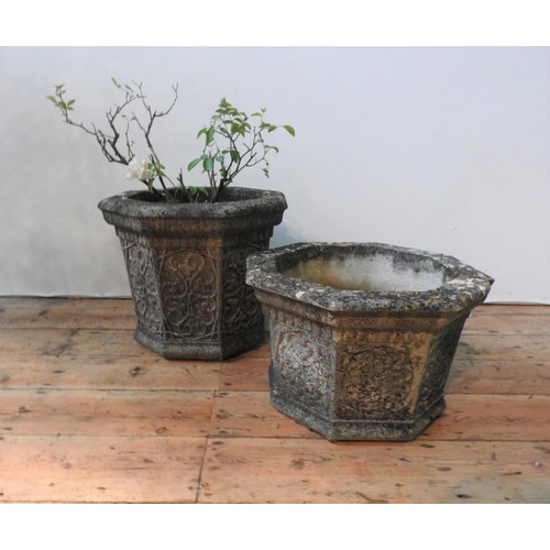 113 - TWO WEATHERED RECONSTITUTED STONE OCTAGONAL GARDEN PLANTERS