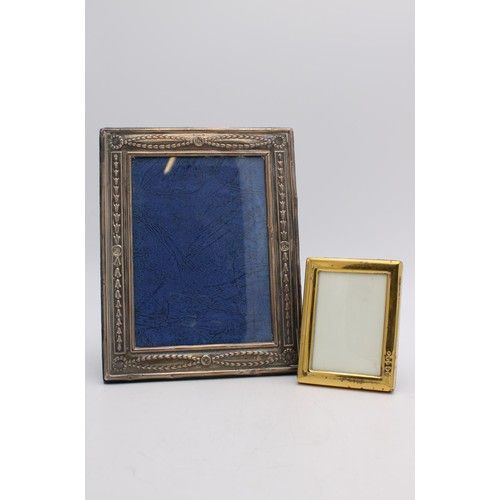 476 - A HALLMARK SILVER PICTURE FRAME AND A SMALLER GILDED HALLMARK SILVER FRAME