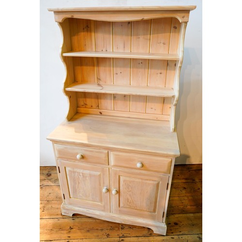 76 - A LIME WASH EFFECT MODERN PINE KITCHEN DRESSER with two panelled doors and two drawers, 167 x 92 x 4... 