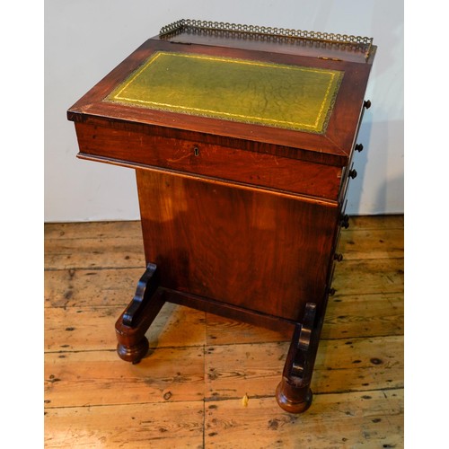 77 - A VICTORIAN ROSEWOOD DAVENPORT WITH FOUR SIDE DRAWERS, FOUR FALSE DRAWERS AND PULL OUT STATIONERY DR... 