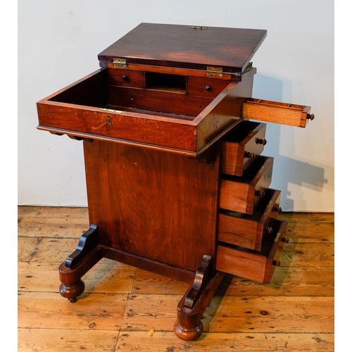 77 - A VICTORIAN ROSEWOOD DAVENPORT WITH FOUR SIDE DRAWERS, FOUR FALSE DRAWERS AND PULL OUT STATIONERY DR... 